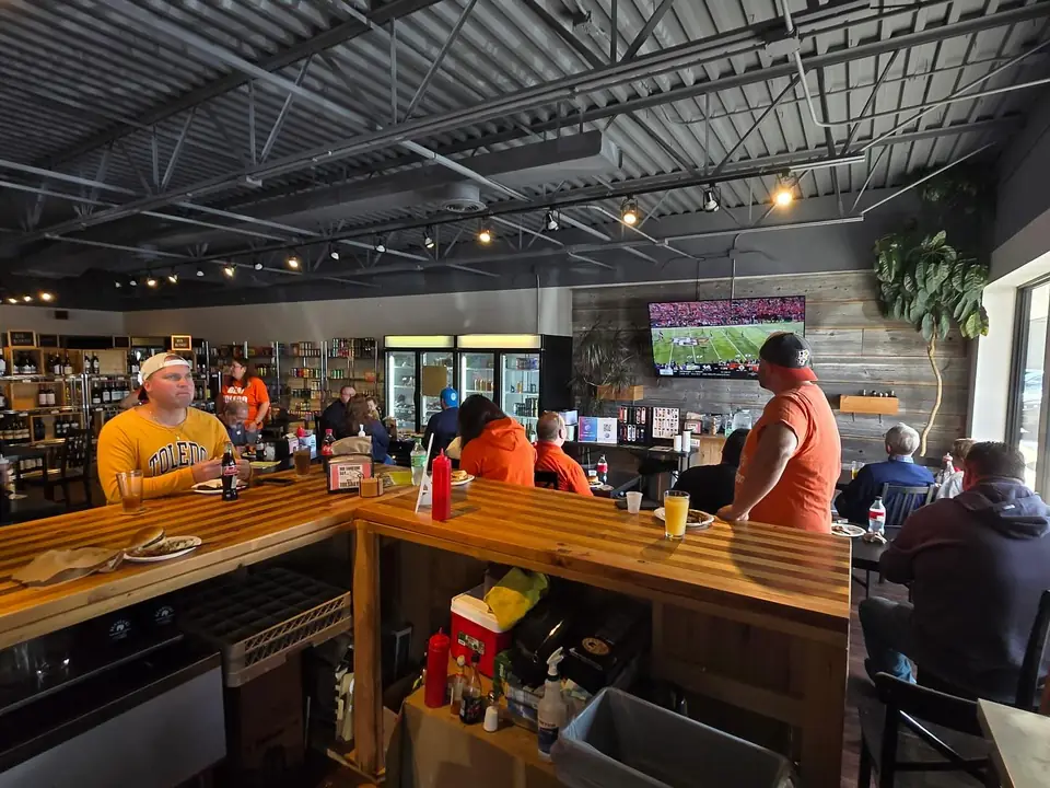 Guests at the bar watching the game