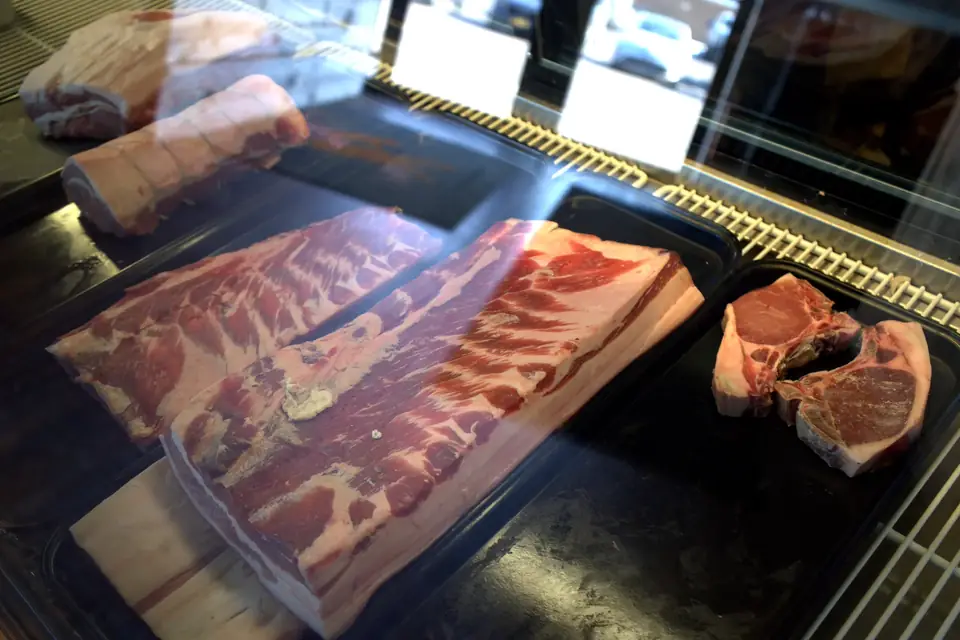 Pork belly, roasts and chops in the butcher case
